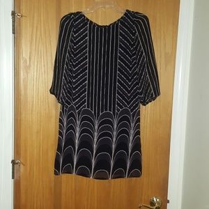 Chic dress, mid-thigh, black and cream.